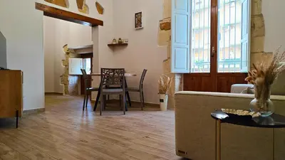 Area soggiorno di Il sussurro delle Nereidi, appartamento boho-chic a Siracusa