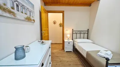 Letto o letti in una camera di Il sussurro delle Nereidi, appartamento boho-chic a Siracusa
