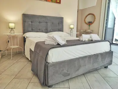 Letto o letti in una camera di Appartamento Esclusivo con Vista Duomo e 5 balconi