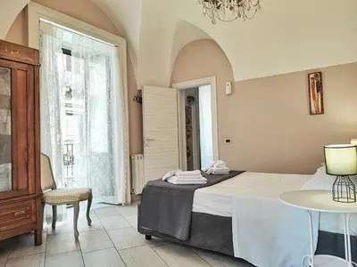 Letto o letti in una camera di Appartamento Esclusivo con Vista Duomo e 5 balconi