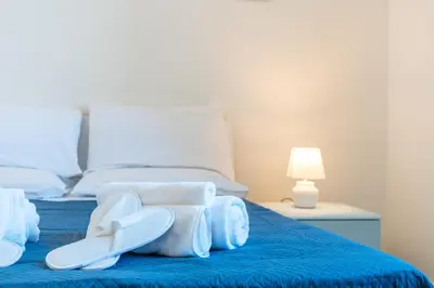 Letto o letti in una camera di Fronte Mare in Palazzo D'Epoca