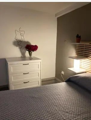 Letto o letti in una camera di La casa al teatro