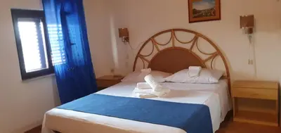 Letto o letti in una camera di Beb Eclissi