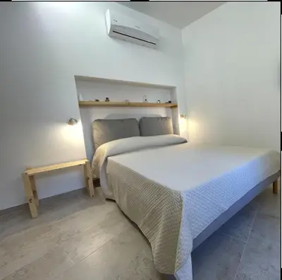 Letto o letti in una camera di Comu veni si cunta