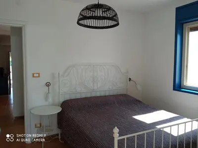 Letto o letti in una camera di Villa Amenta