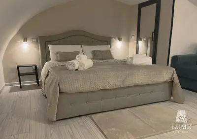 Letto o letti in una camera di Lume Guest House