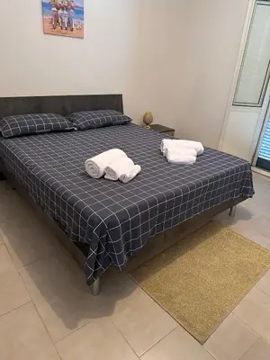 Letto o letti in una camera di Anna's House near Airport