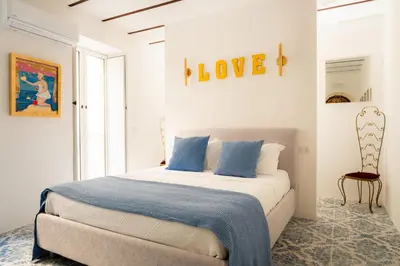 Letto o letti in una camera di Ortigia Courtyard Apartment by Ortigia Apartments