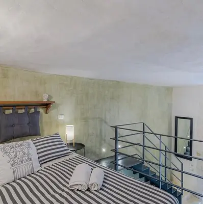 Letto o letti in una camera di Gargallo Loft in Ortigia