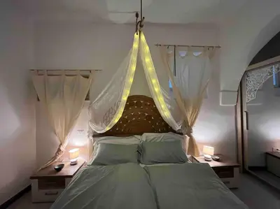 Letto o letti in una camera di Casa Failla - Das Nest am Meer