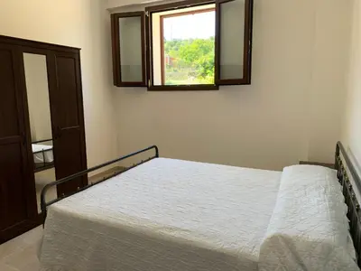 Letto o letti in una camera di Villa Santa Lucia