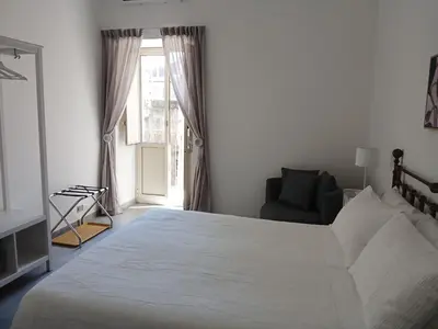 Letto o letti in una camera di Casa Arancio