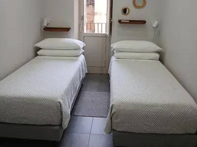 Letto o letti in una camera di Casa Arancio