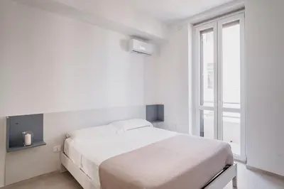 Letto o letti in una camera di DimoraArsenale