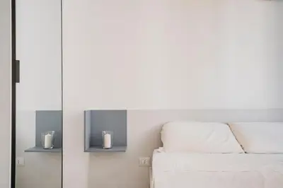 Letto o letti in una camera di DimoraArsenale