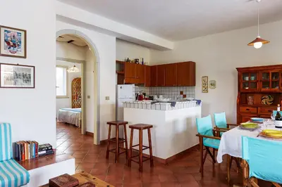 Cucina o angolo cottura di Casa Vacanza Ondablu CaseSicule, on the Beach with big Veranda and Wifi
