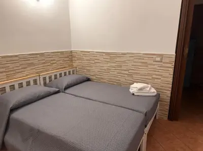 Letto o letti in una camera di Il rifugio Comoda e accogliente Casetta