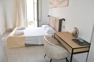 Letto o letti in una camera di Yllen Rooms