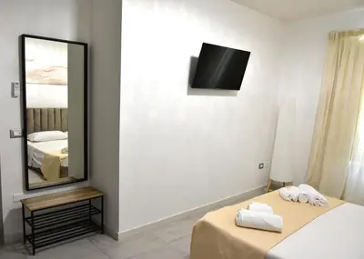 Letto o letti in una camera di Yllen Rooms