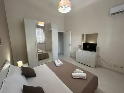 Letto o letti in una camera di Casa Alessia