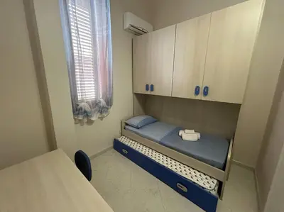 Letto o letti in una camera di Casa Alessia