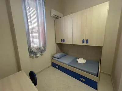Letto o letti in una camera di Casa Alessia