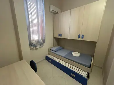 Letto o letti in una camera di Casa Alessia