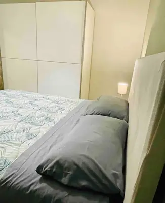 Letto o letti in una camera di VENTO D ESTATE Brucoli