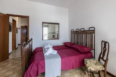 Letto o letti in una camera di Casa Iblea