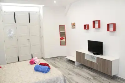 TV o dispositivi per l'intrattenimento presso Carla Home - few steps to Ortigia