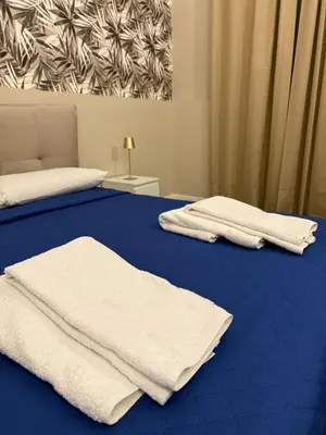 Letto o letti in una camera di DeLucaHome