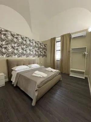 Letto o letti in una camera di DeLucaHome