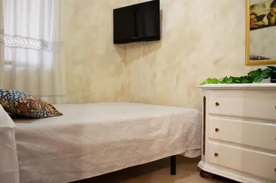 Letto o letti in una camera di La Maison Sicula