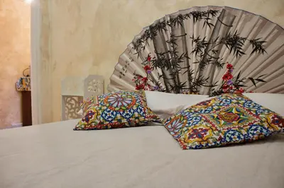 Letto o letti in una camera di La Maison Sicula