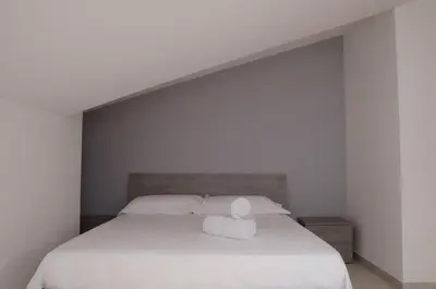Letto o letti in una camera di Dolcevita Marzamemi
