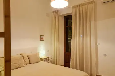 Letto o letti in una camera di ELIOS Apartment