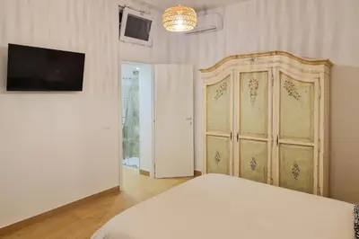 Letto o letti in una camera di ELIOS Apartment