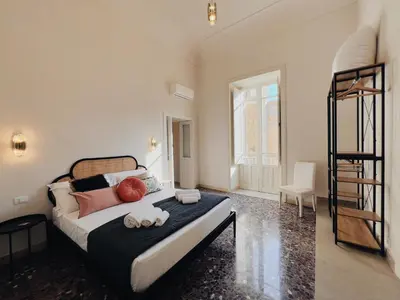 Letto o letti in una camera di Iconic Ortigia Residence - CarAccess PrimeLocation DiningGuide