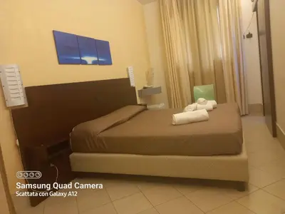Letto o letti in una camera di Hotel Villa Ionia