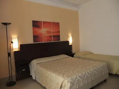 Letto o letti in una camera di Hotel Villa Ionia