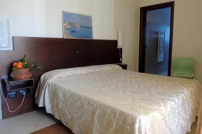Letto o letti in una camera di Hotel Villa Ionia