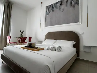 Letto o letti in una camera di Serèsia Rooms Siracusa Centro