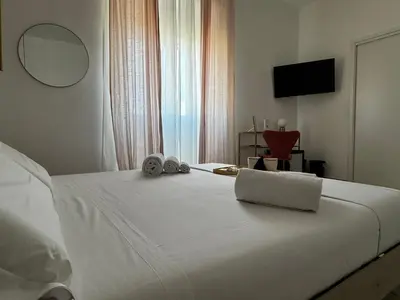 Letto o letti in una camera di Serèsia Rooms Siracusa Centro