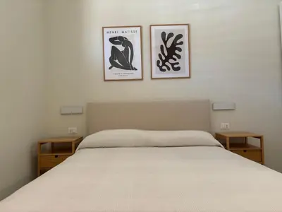Letto o letti in una camera di Casa Bernini