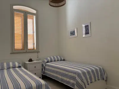 Letto o letti in una camera di Casa Bernini