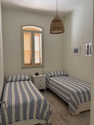 Letto o letti in una camera di Casa Bernini