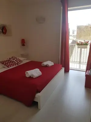 Letto o letti in una camera di La Casa di Charme