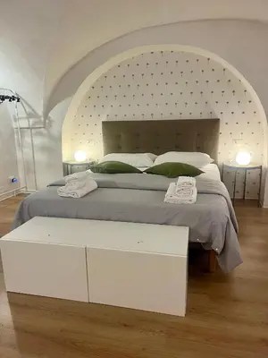 Letto o letti in una camera di VagaLuna Short Stay