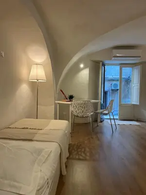 Letto o letti in una camera di VagaLuna Short Stay