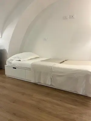 Letto o letti in una camera di VagaLuna Short Stay